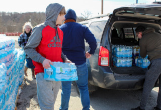 Volunteers work to distribute bottled water to residents of East Palestine. These efforts were supported by Feed the Children and Niagara Bottling.