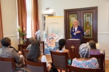 Volunteer Minister shares her experience with those gathered