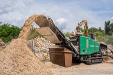 The Komptech Lacero horizontal Grinder processing wood waste.