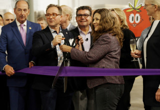 Founders Mike Zelkind and Tisha Livingston, joined by employees and special guests, open the farm