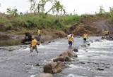 When roads were submerged the volunteers continued by foot.