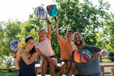 Family playing in Pickleball