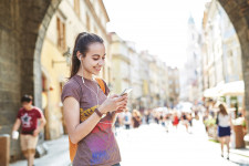 Girl using SmartGuide to explore historical city