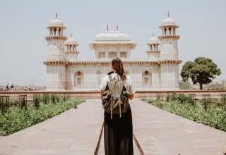 Traveler in Front of Prominent Building