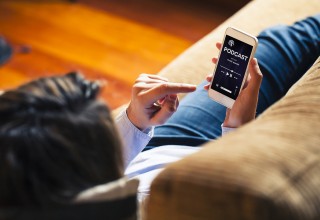 Woman Listening to Finance Podcast