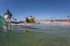 Skyler the surf dog tandem surfing with human Photo by Daren Fentiman