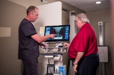 Dr. John Schofield with chiropractic Patient