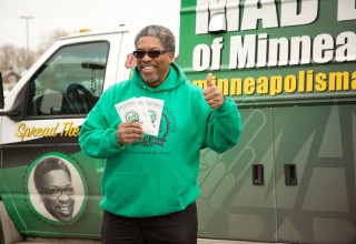 V.J. Smith, founder and president of MAD DADS Minneapolis, with his customized copy of The Way to Happiness