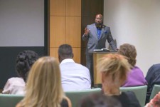 Entrepreneur Christopher King at a seminar on The Way to Happiness