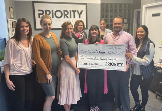 President Angelo Mendola presents check to Susan G. Komen.