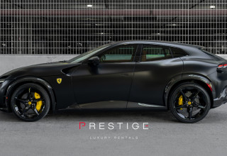 Black Ferrari Purosangue front view at Prestige Luxury Rentals in Miami