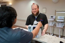 US Med-Equip employee at hospital delivering medical equipment