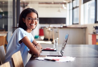 Happy Woman at Computer