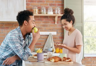 Couple Eating Breakfast Together