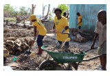 Clearing out rubble and debris in a Haitian village in the wake of Hurricane Matthew.