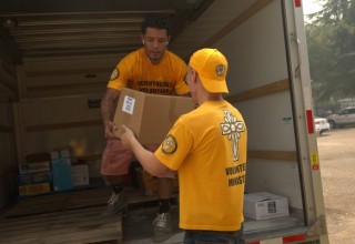 Loading a truck with needed supplies.