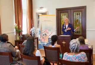 Volunteer Minister shares her experience with those gathered