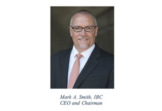 A person wearing a suit and tieDescription automatically generated with medium confidence