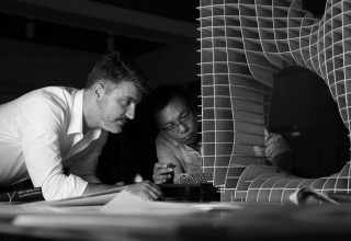 Ray Cheung and his partner Hakan Ozkan discuss the model-making project.