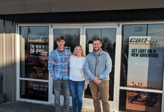 Sellers with Buyer at MotoGear Warehouse storefront