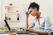Stressed Woman on Computer at Home