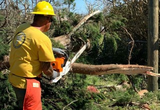  Scientology Volunteer Ministers wielding chainsaws