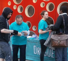 Volunteers take their message directly to local residents at a drug information booth in the heart of Brussels.