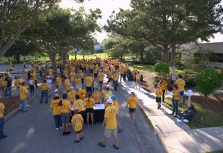 Scientology Volunteer Ministers assemble at the Martin Luther King Jr. Community Center for a cleanup of the North Greenwood neighborhood. 