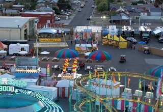 Bright yellow pavilion of the Scientology Volunteer Ministers