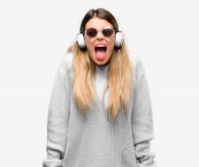 Woman Listening to Pop Music and Screaming