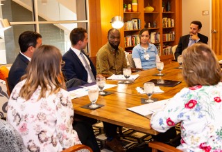 Senator Rogers listens to Samuel Gbortsu share his Trilogy growth story