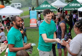 Handing out drug education booklets